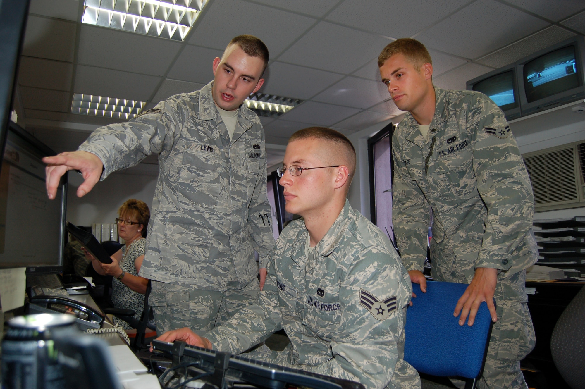 WRIGHT-PATTERSON AIR FORCE BASE, Ohio – Senior Airman James Lewis, 86th Vehicle Readiness Squadron, trains alongside Senior Airman Ryan Lucas, and Airman First Class Gabriel Page, both from the 445th Logistics Readiness Squadron, vehicle operations flight, at Ramstein Air Base Germany, June 9. More than 40 members of the 445 LRS spent their annual tour in Germany June 5-19. (U.S. Air Force photo/Maj. Jose Cardenas) 