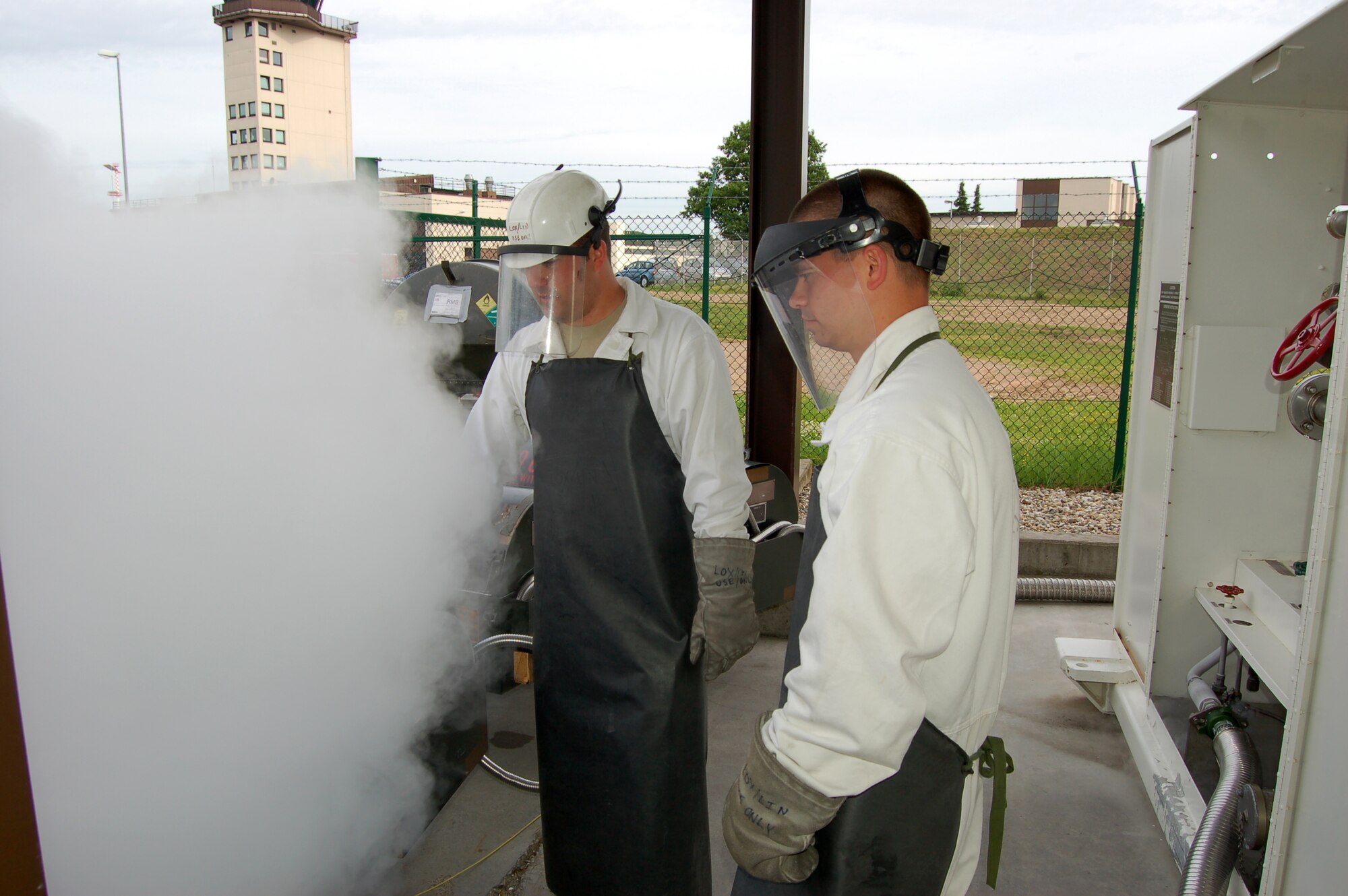 WRIGHT-PATTERSON AIR FORCE BASE, Ohio – Senior Airman Chris Morris, 86th Logistics Readiness Squadron, works alongside Staff Sgt. Joshua Burhardt, 445th Logistics Readiness Squadron, at Ramstein Air Base, Germany, to service Liquid Oxygen for an aircraft, June 9. More than 40 members of the 445 LRS spent their annual tour in Germany June 5-19. (U.S. Air Force photo/Maj. Jose Cardenas)