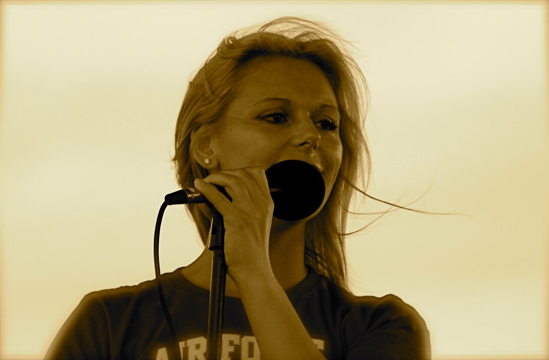 Senior Airman Courtney Clifford performs with Top Flight performs at Woodlawn Lake Park in San Antonio on the 4th of July, 2010.