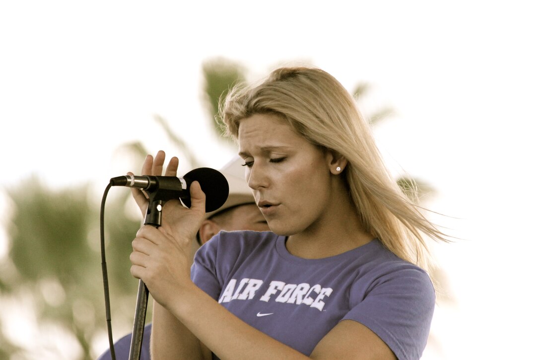 Senior Airman Courtney Clifford performs with Top Flight performs at Woodlawn Lake Park in San Antonio on the 4th of July, 2010.