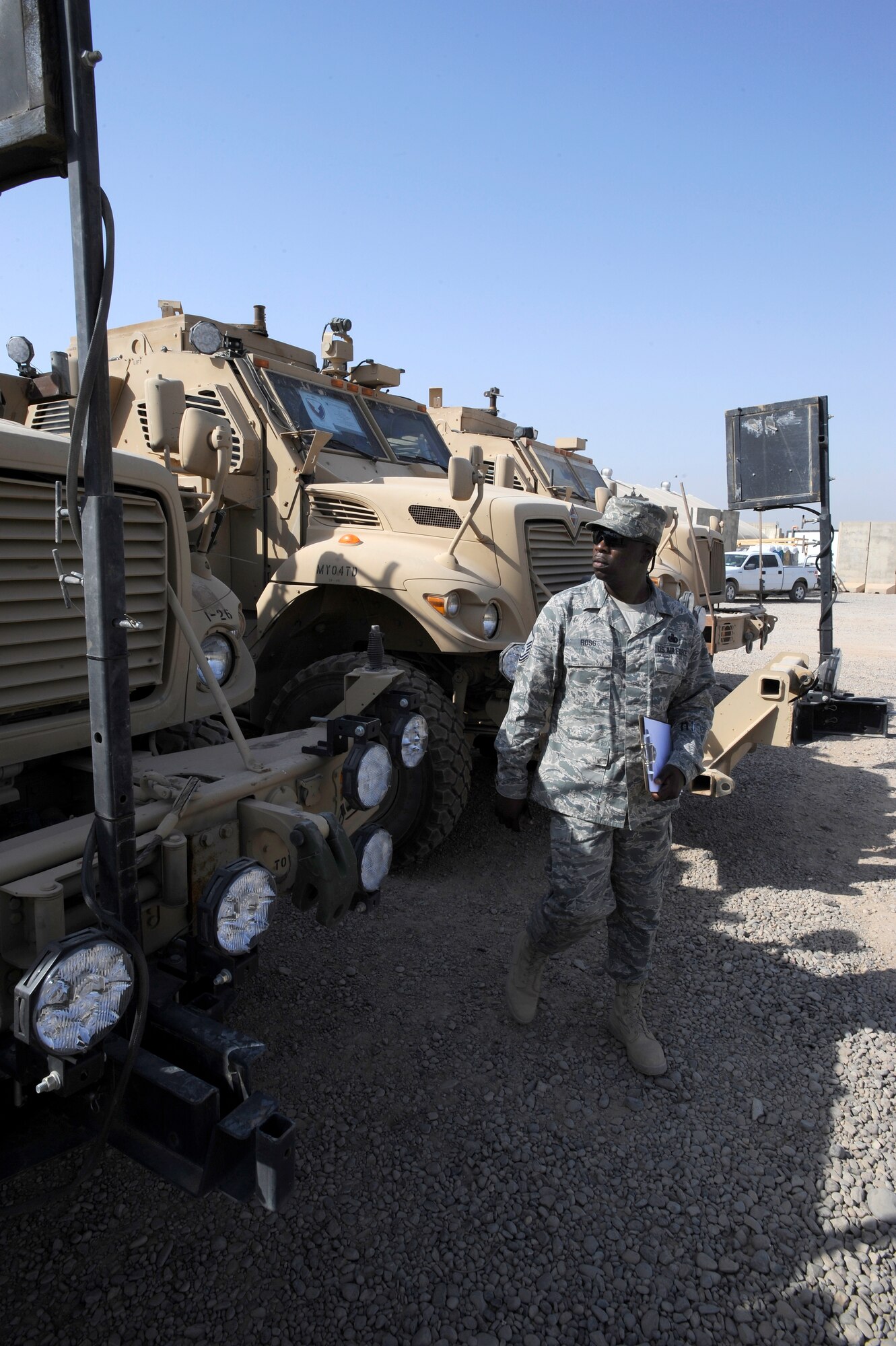 Master Sgt. Ezekiel Ross does a routine walk around on a set of mine-resistant, ambush-protected vehicles June 16, 2010, at the Redistribution Property Assistance Team Yard, Joint Base Balad, Iraq. The Airmen and Soldiers working at the RPAT yard log and inspect equipment as small as laser pointers, which are processed, wrapped, and boxed, to MRAPs which are parked in the yard awaiting transportation. Sergeant Ross is assigned to the 732nd Expeditionary Logistics Readiness Squadron. (U.S. Air Force photo/Senior Airman Matt Coleman-Foster)