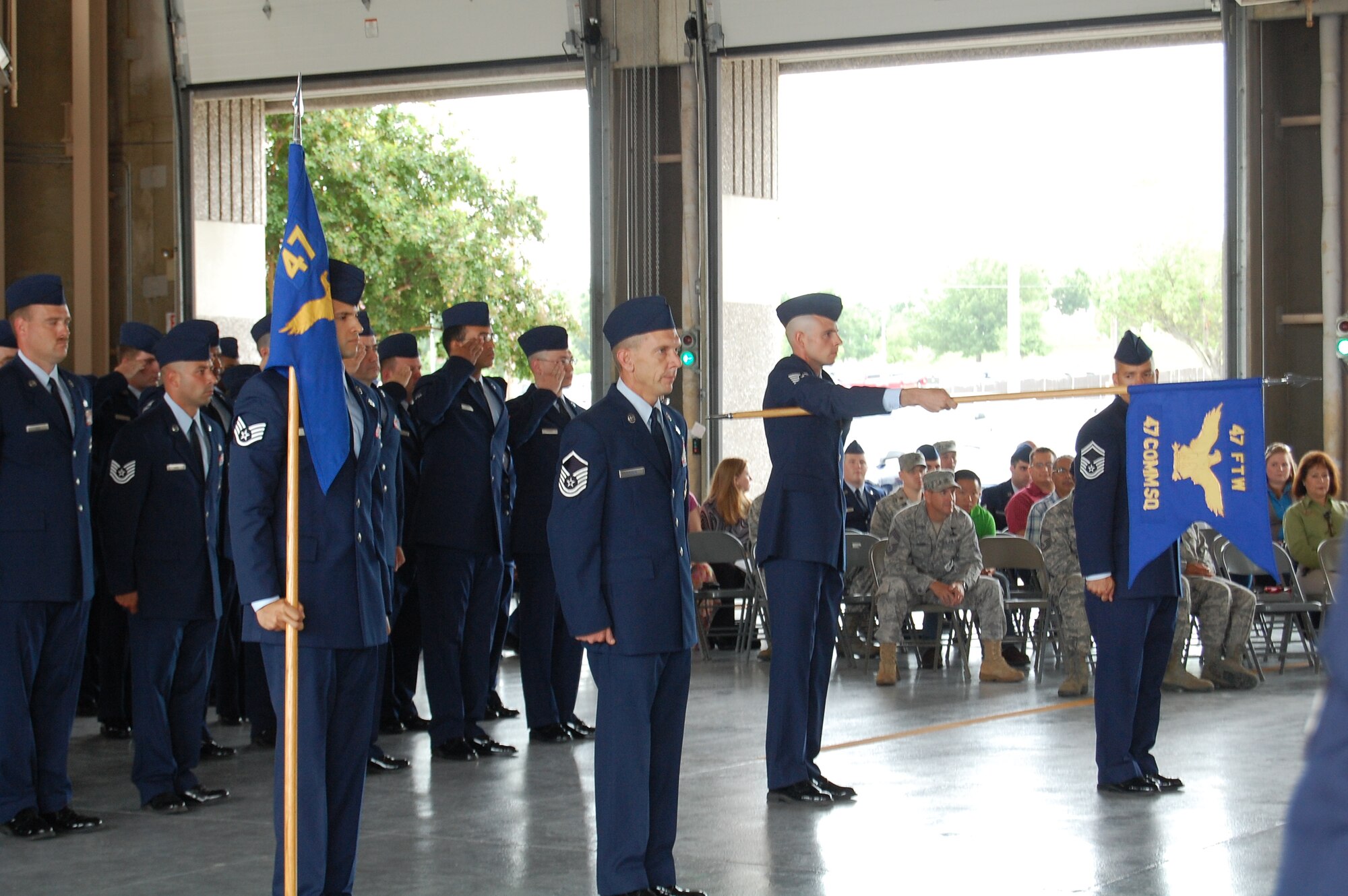 LAUGHLIN AIR FORCE BASE, Texas – Airmen from the 47th Civil Engineering Squadron and the 47th Communications Squadron, stand in formation to honor the establishment of the squadrons. The 47th Installation Support Squadron deactivated during a ceremony at 9:47 a.m. June 30 dividing into the two new squadrons. (U.S. Photo by Staff Sgt. Desiree Economides)