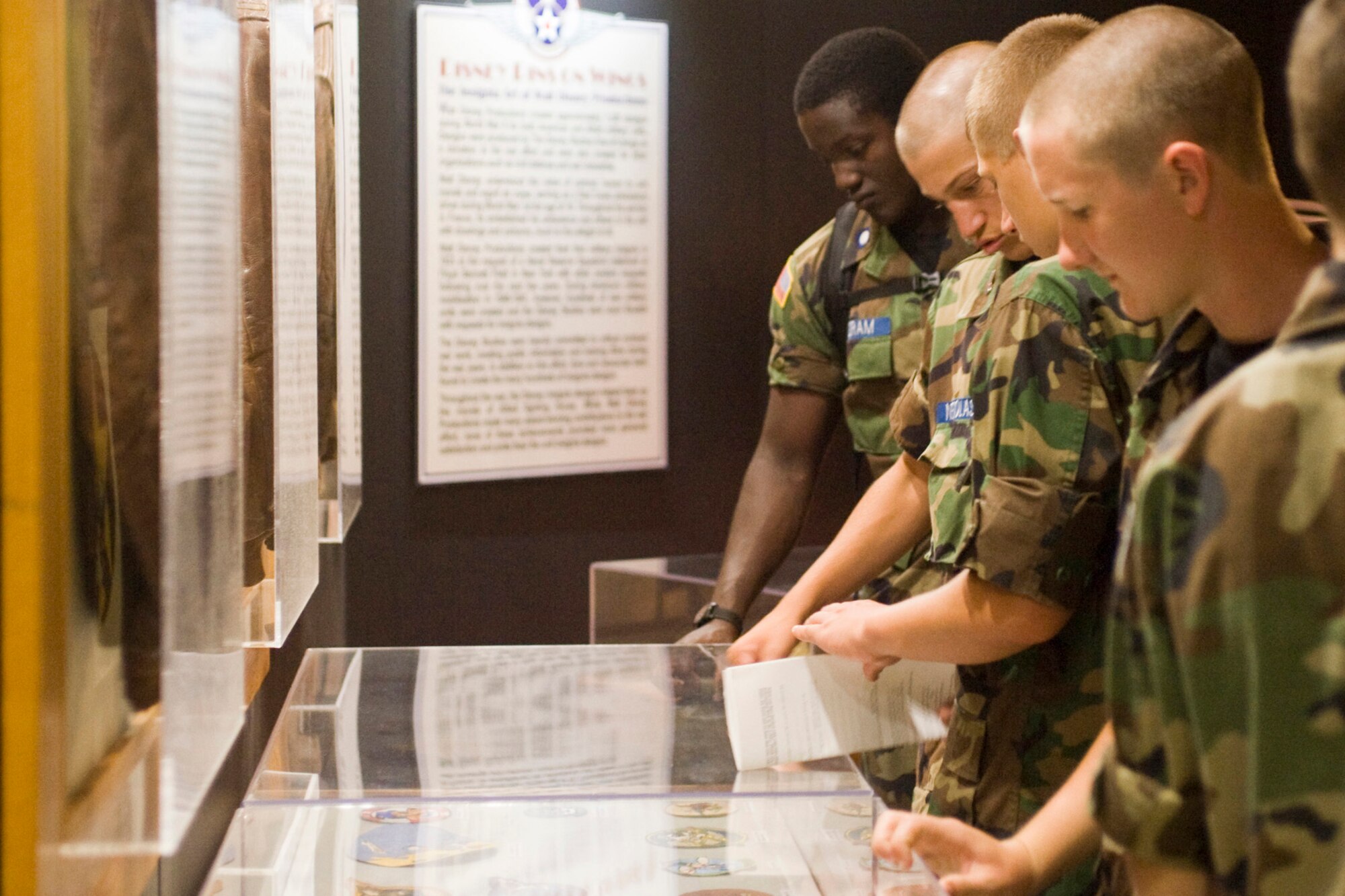 YOUNGSTOWN AIR RESERVE STATION, Ohio--A group of Civil Air Patrol (CAP) cadets look at historic Air Force unit patches while touring the National Museum of the US Air Force, Wright-Patterson Air Force Base (AFB), Ohio. Approximately 130 cadets flew to Wright-Patterson AFB Wednesday as part of a week-long CAP encampment here.