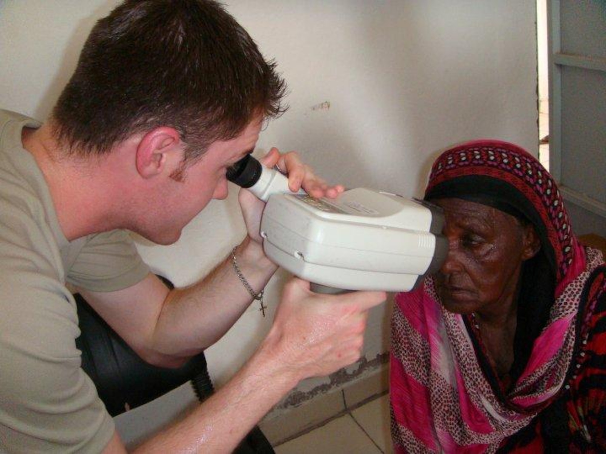 Staff Sgt. Travis Harris, 48th Aerospace Medicine Squadron optometrist assistant pre-screens a patient during a Medical Civic Action Program in Djibouti, Africa, June 3. The 48th AMDS team received and treated patients with a wide variety of ocular health conditions. (U.S. Air Force photo/Tech. Sgt. Sarah Mayersky)