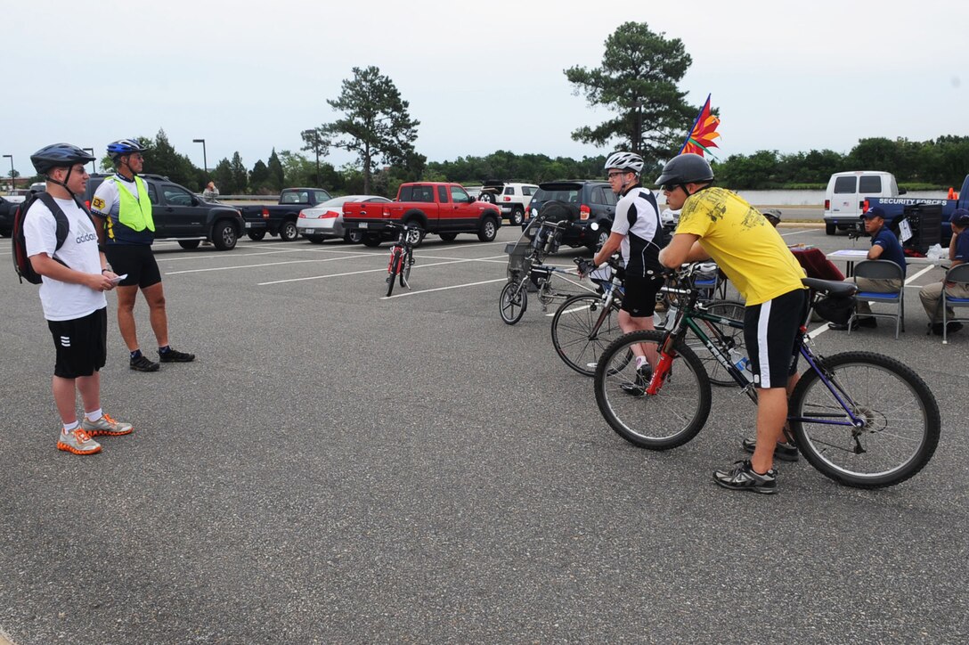 LANGLEY AIR FORCE BASE, Va. -- Staff Sgt. Joseph Biscoe (far left), 480th Intelligence Surveillance Reconnaissance Wing mission manager, shares his story of a fallen comrade June 30 before the Ride of Silence. Langley participated in the annual ride for the first time this year to honor fallen cyclists. (U.S. Air Force photo/Staff Sgt. Ashley Hawkins) (RELEASED)