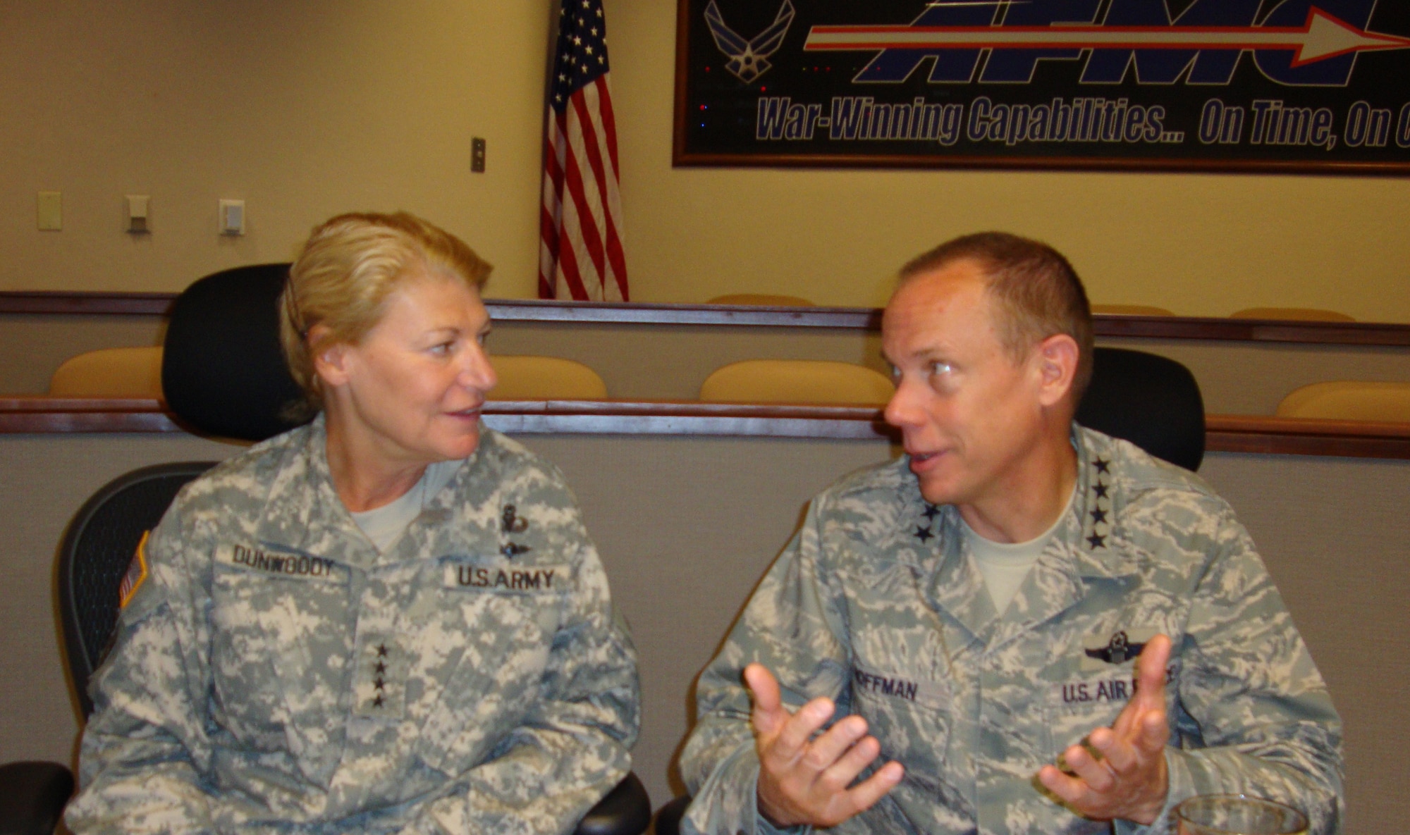 Gen. Ann Dunwoody, commanding general of United States Army Materiel Command, discusses weapon-systems acquisition with Gen. Donald Hoffman, Air Force Materiel Command commander, during a visit to Headquarters AFMC July 1. The meeting gave the generals and their staffs the opportunity to discuss an acquisition review directed by the Secretary of the Army and the lessons learned by the Air Force in executing its ongoing acquisition improvement plan. AFMC senior staff emphasized the importance of establishing clear lines of authority and accountability within acquisition organizations. General Dunwoody and her staff also were especially interested in how AFMC handles the complexities of translating the needs of warfighters into acquisition requirements. (U.S. Air Force photo/Michelle Eviston) 
