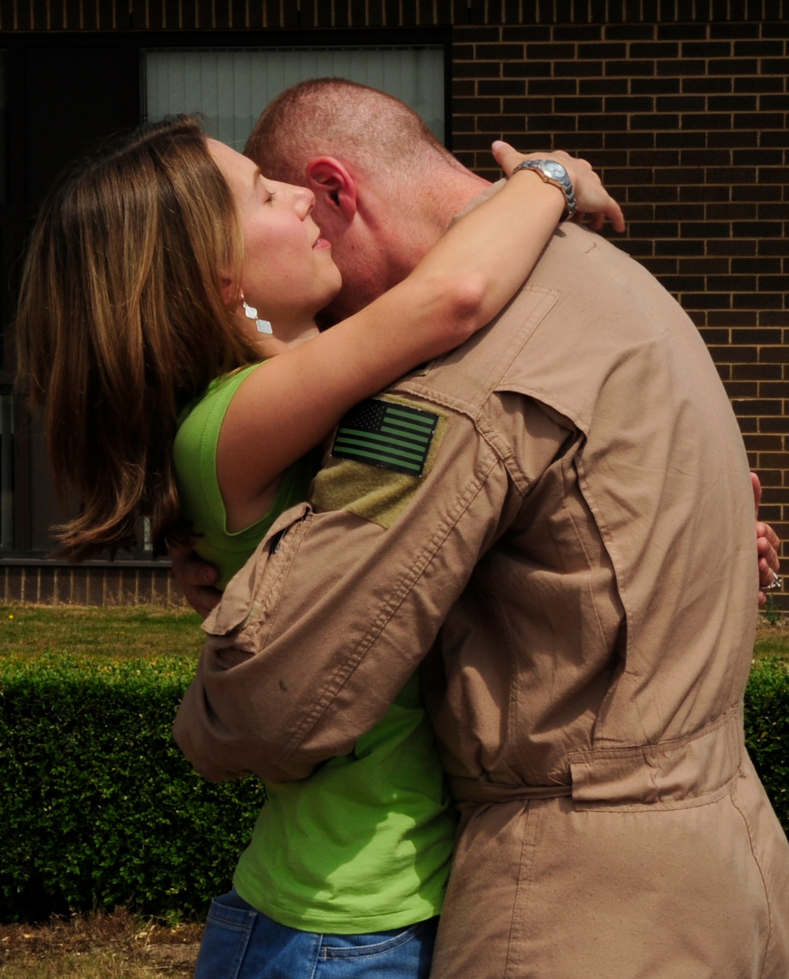 RAF MILDENHALL, England – Sarah Loveless greets her husband 1st Lt. Jason Loveless, 67th Special Operations Squadron, as he returns home from a deployed location, July 2.  The eight-member group of returnees was warmly greeted by friends and family.  (U.S. Air Force photo/Staff Sgt. Christopher L. Ingersoll)