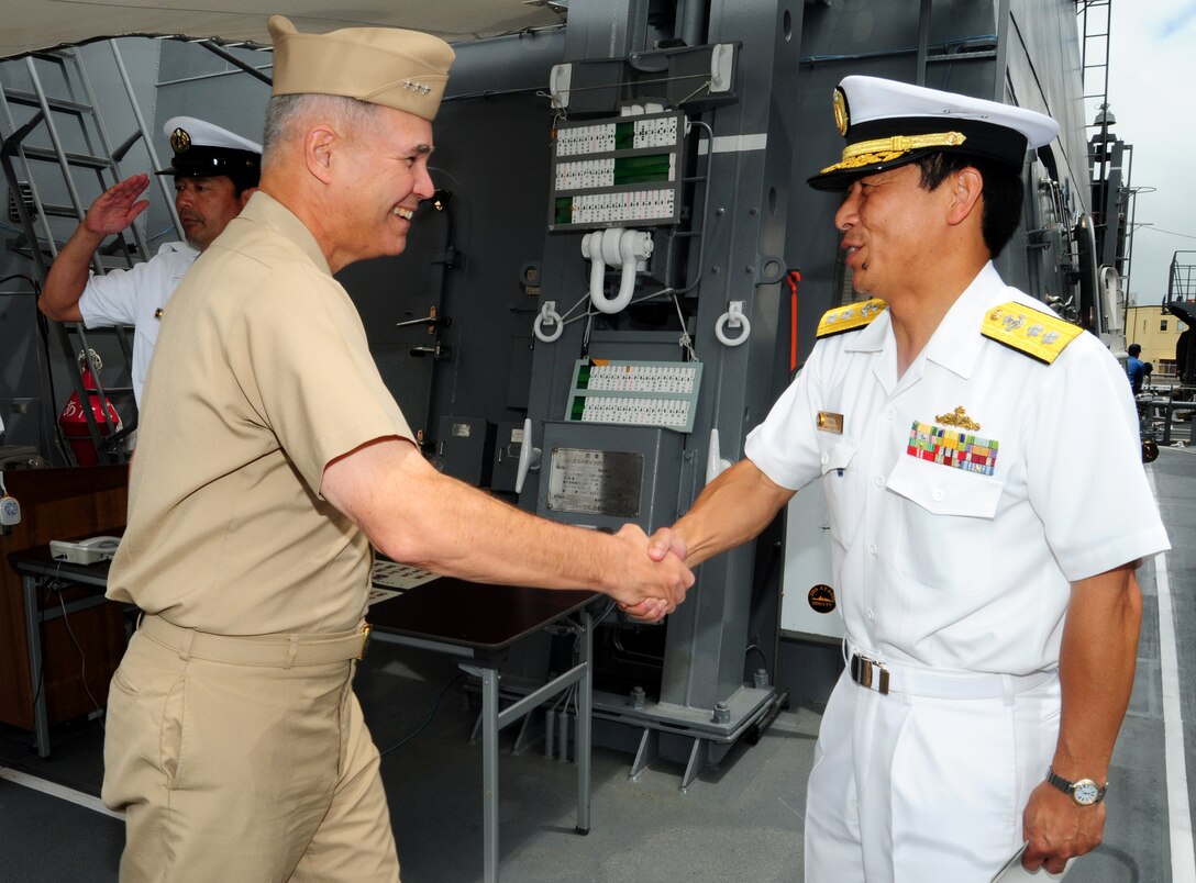 Japanese Maritime Self-Defense Force Rear Adm. Kazuki Yamashita, right, welcomes U.S. Navy Vice Adm. Richard W. Hunt, commander of the U.S. 3rd Fleet, aboard the Japanese guided missile destroyer JS Atago to discuss exercise operations in Pearl Harbor, Hawaii, June 29, 2010.  Yamashita is assistant deputy commander of Combined Task Force for Rim of the Pacific 2010. 