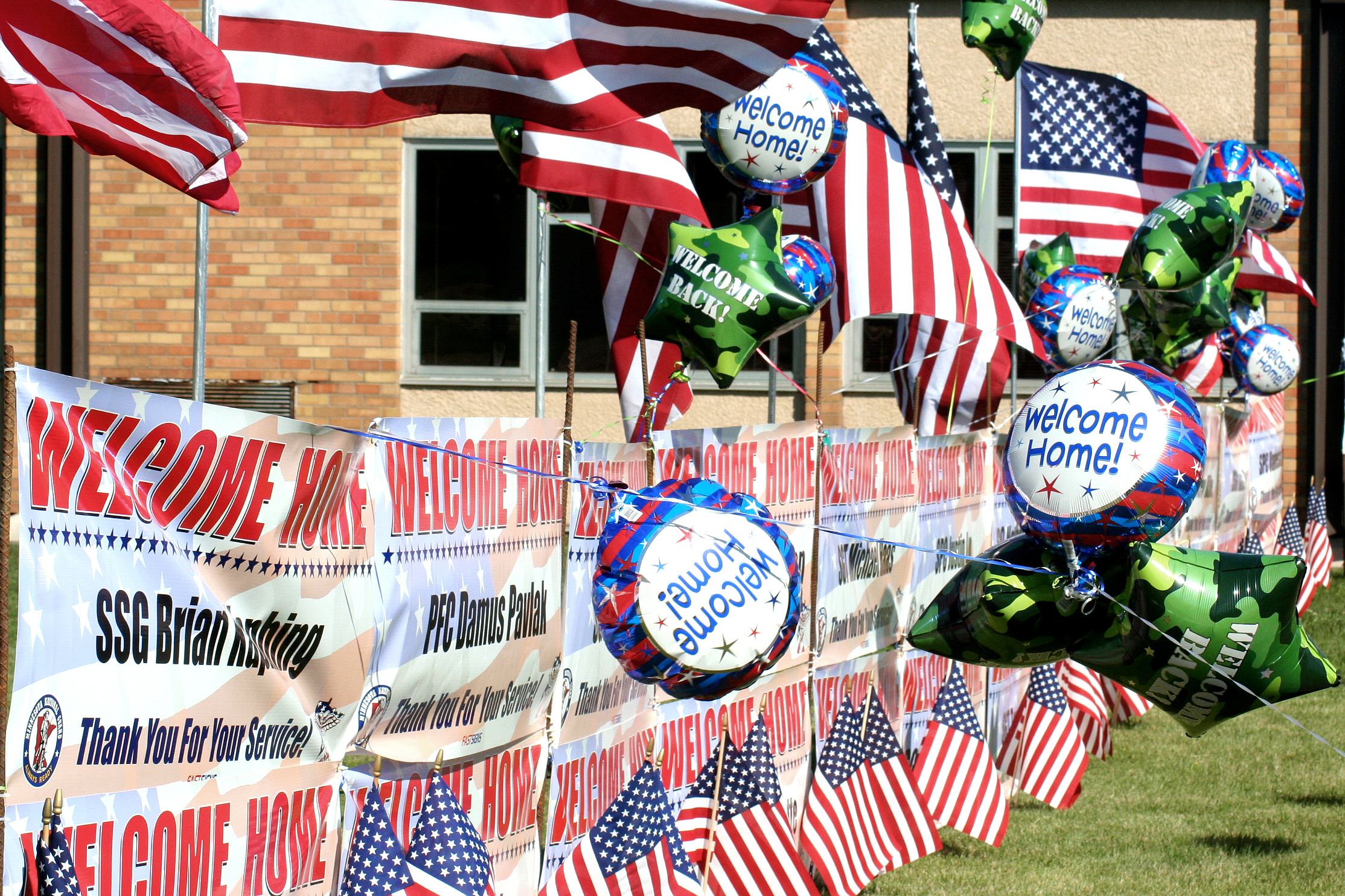 Flags Balloons And Signs Decorate A Fence As More Than 60 U S