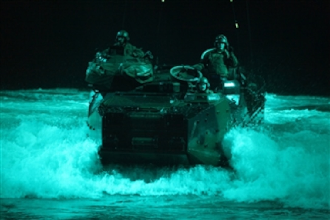 U.S. Marines with 4th Platoon, Charlie Company, 3rd Assault Amphibian Battalion, 1st Marine Division return to the amphibious transport dock USS New Orleans (LPD 18) after repairing the transmission of an amphibious assault vehicle on a beach in Ancon, Peru, on July 4, 2010.  The Marines were embarked aboard the USS New Orleans in support of Partnership of the Americas/Southern Exchange, a combined amphibious exercise with maritime forces from Argentina, Mexico, Peru, Brazil, Uruguay and Colombia.  