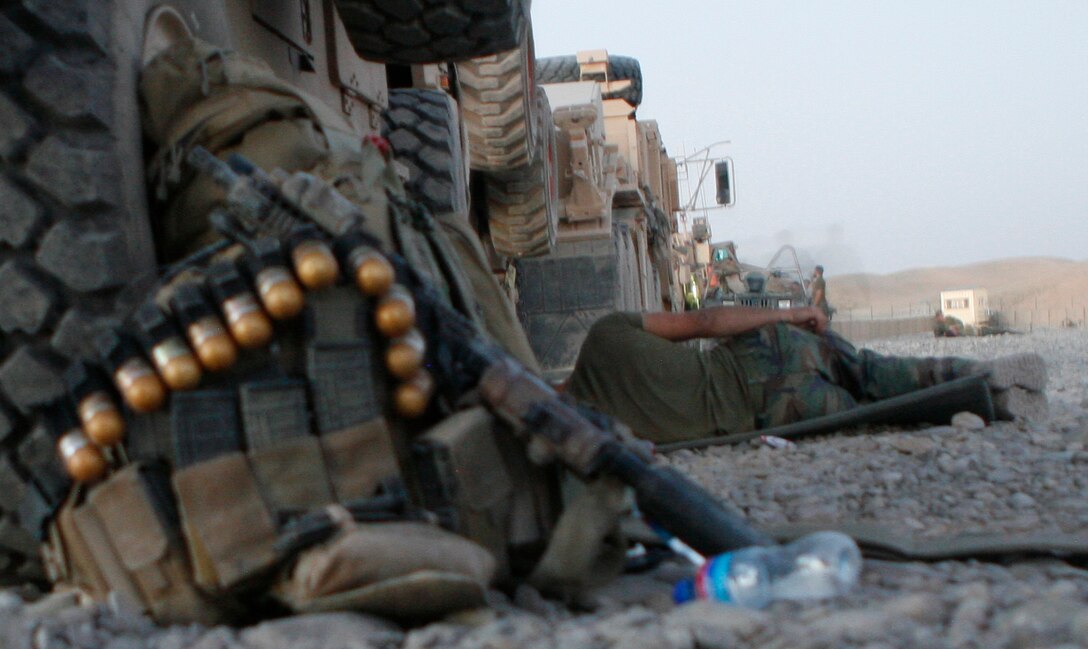 A Marine with a Marine Special Operations Team gets some sleep while waiting for vehicle repairs in Moqur, Afghanistan July 6. ANA soldiers alongside U.S. Special Forces troops moved into Darrah-I-Bum to establish a Forward Operating Base there with the hopes of alleviating security issues in an area with heavy insurgent activity.
