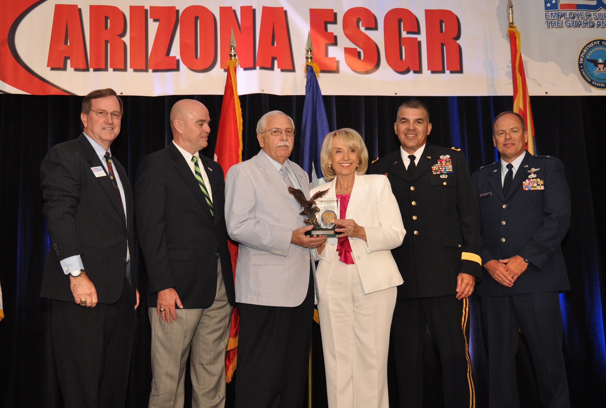 Pictured from left to right, Arizona ESGR Field Chairman Scott Essex, NCESGR Deputy Executive Director Phil Pope, Arizona Chair Emeritus Bill Valenzuela,  Arizona Governor Jan Brewer, Arizona Adjutant General Maj. Gen. Hugo Salazar, and Commander, 162nd Fighter Wing, Arizona Air National Guard, Brig. Gen. Gregory Stroud present Bill Valenzuela his ESGR Lifetime Achievement Award for more than 30 years of dedicated service with the Arizona ESGR Field Office. Mr. Valenzuela continues to be a staunch supporter of ESGR and the service members they serve.  (Army photo by Sgt. Ed Balaban)