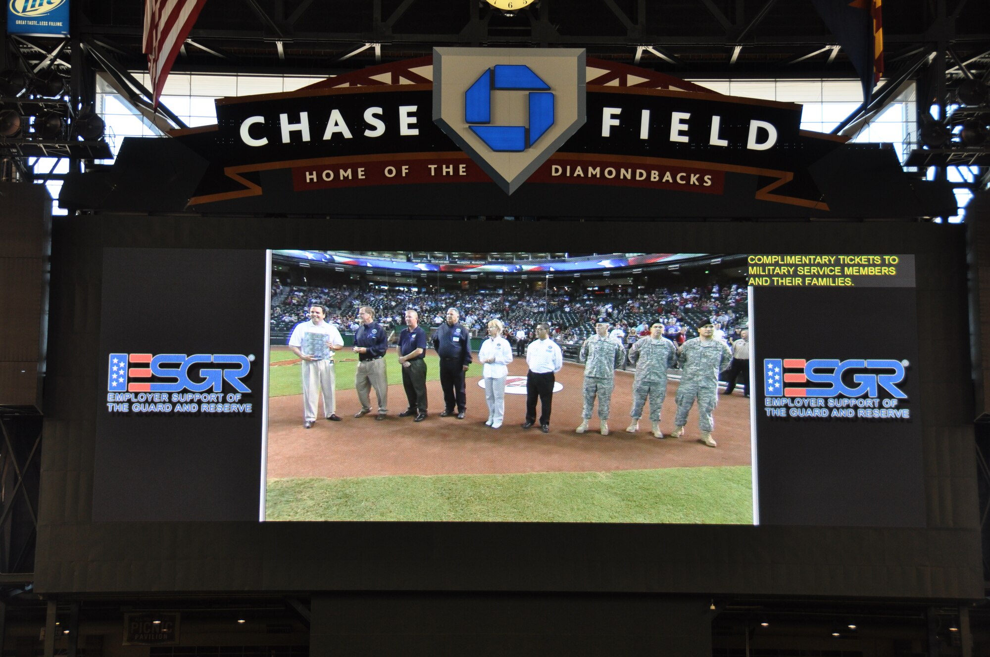 Arizona ESGR Field Chairman Scott Essex presents the Arizona Diamondbacks Team President Derrick Hall with an ESGR Statement of Support plaque during the Military Appreciation day pre-game show at home plate.  Mr. Hall earlier in the day signed an ESGR Statement Support demonstrating the Arizona Diamondbacks' support of the men and women who serve in the Guard and Reserves.  Mr. Hall also was presented an ESGR coin by Mr. Essex for the Diamondbacks continued support of the military men and women and their families. (Army photo by Sgt. Ed Balaban)