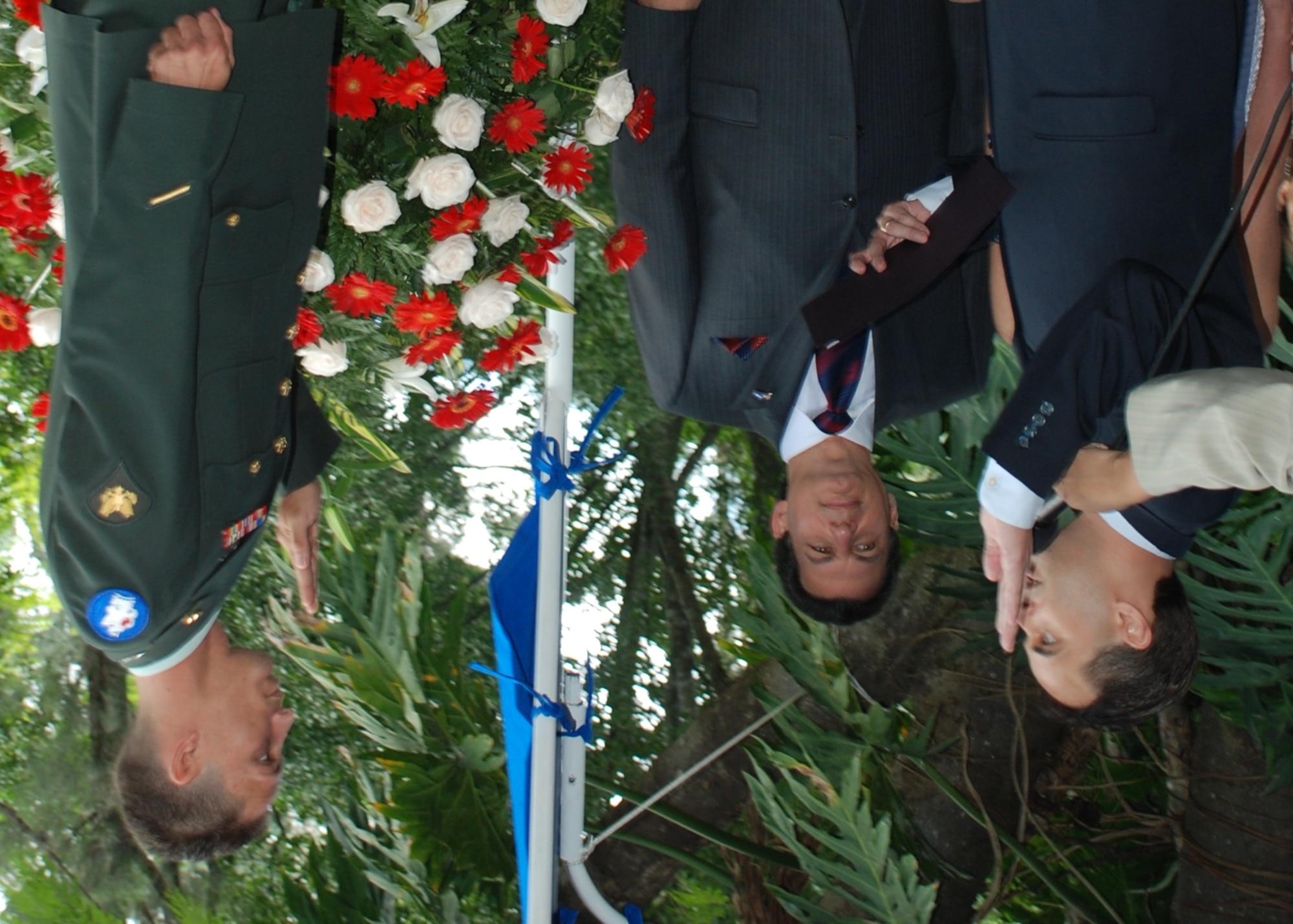 Spc. Eniol Abreusarmiento, a helicopter mechanic and crew chief in the 1-228th Aviation Regiment, Soto Cano Air Base, Honduras, recites the naturalization oath administered by Emigdio Martinez, the field office director for the Office of Citizenship and Immigration Services during a ceremony in Tegucigalpa July 2. Specialist Abreusarmiento, who was born in Cuba, became a U.S. citizen at an Independence Day celebration hosted by U.S. Ambassador to Honduras Hugo Llorens and attended by Honduran President Porfirio Lobo. (U.S. Air Force photo by 1st Lt. Jen Richard)