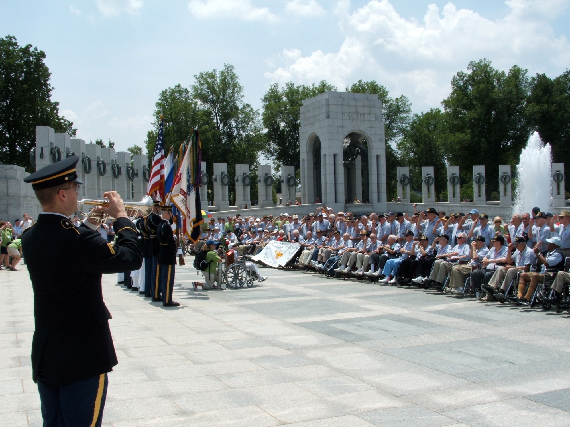 World War II veterans are presented the colors during a visit to the World War II memorial in Washington D.C., June 23, 2010. The trip, designed through the Honor Flight Network Program, does not charge the veterans anything but their time. The Honor Flight Network Program's philosophy is since "America felt it was important to build a memorial to honor her veterans, the Honor Flight Network believes it's equally important that they actually get to visit and experience their memorial." (Courtesy photo)