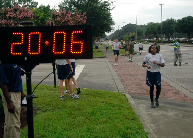 U.S. Air Force Airman 1st Class Jennifer Albarez finishes first for the females  during the Commander's Fitness Challenge on Joint Base Charleston, S.C., July 1, 2010. Airman Albarez finished the two-and-half mile course in 20 minutes 6 seconds. (U.S. Air Force photo/Senior Airman Timothy Taylor)