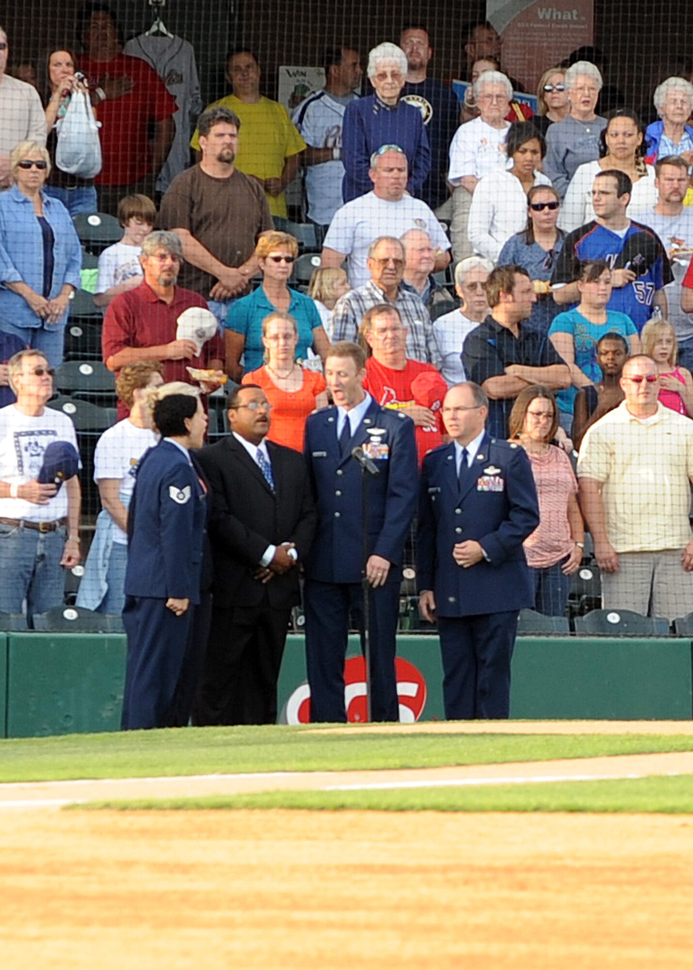 ST. LOUIS, Mo. -- The group, 4-Digit Chord, performs at an NFL game.  The singers from Scott perform at ceremonies on base, as well as major sporting events off base. (Courtesy Photo)