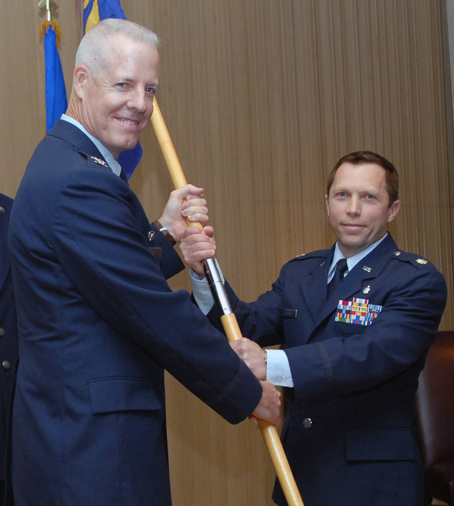 Col. Timothy Bray (left), 82nd Medical Group commander, passes the 82nd Aerospace Medicine Squadron guidon to Lt. Col. Kirk Winger, incoming 82nd AMDS commander, at a change of command ceremony at Bldg. 1900 on Sheppard Air Force Base, Texas, July 1, 2010. Colonel Winger arrived at Sheppard after serving as the 86th AMDS Public Health flight commander at Ramstein Air Base, Germany. (U.S. Air Force photo/ LouAnne Sledge)
