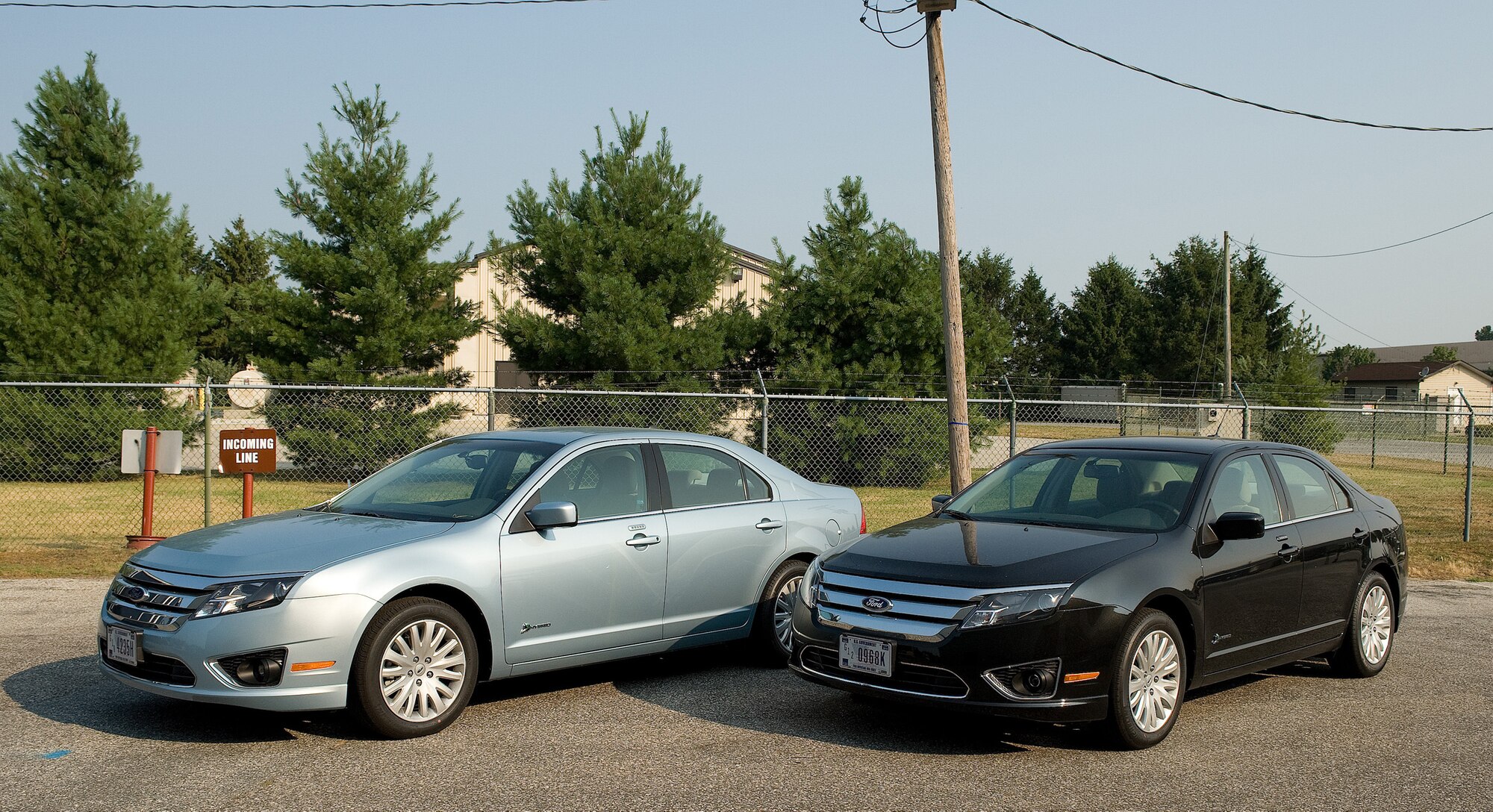 The two new hybrid vehicles parked outside the 436th Logistics Readiness Squadron Vehicle Management Flight building arrived at Dover Air Force Base, Del., June 22, 2010. These hybrids replaced two vehicles being rotated out of the fleet under the General Service Administration program. (U.S. Air Force photo by Jason Minto/Released)