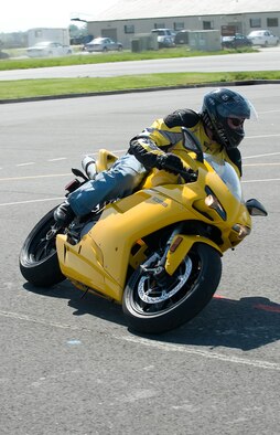 Senior Master Sgt. Ed Renneckar, 436th Airlift Wing Plans and Programs Superintendent, practices sport-bike cornering techniques at the motorcycle safety range at Dover Air Force Base, Del., May 6, 2010. Sergeant Renneckar is the Wing Motorcycle Safety representative and Dover Green Knights Chapter 49 Vice-President. (U.S. Air Force photo by Brianne Zimny/Released)