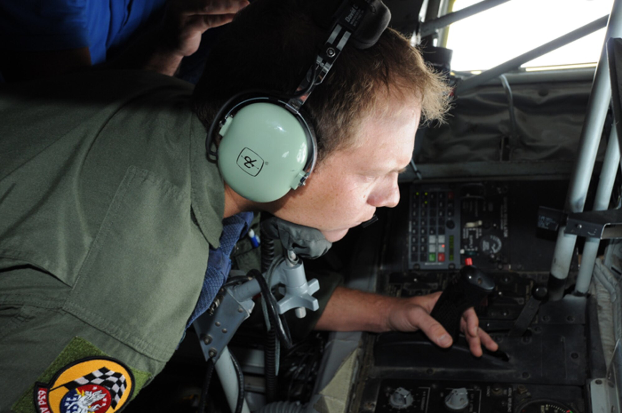 Tech. Sgt. Matthew Janson, a boom operator with the 63rd Air Refueling Squadron, demonstrates how a KC-135 Stratotanker is used for aerial refueling June 18, 2010 at MacDill Air Force Base, Fla. The demonstration was part of a bosslift through Employer Support for the Guard and Reserve. (U.S. Air Force photo by Senior Airman Anna-Marie Wyant)