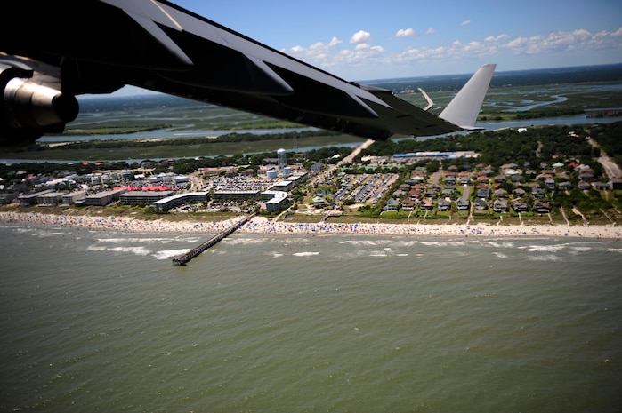 Airmen with the 14th Airlift Squadron, Joint Base Charleston, S.C., fly a Charleston C-17 Globemaster III 500 feet above the shoreline from Myrtle Beach, S.C., to to Hilton Head Island, S.C., during the Salute from the Shore Flyover July 4, 2010. The C-17 flew 2,000 feet off the shoreline at low levels ranging from 500 to 1,000 feet. (U.S. Air Force photo/Staff Sgt. DeNoris Mickle)