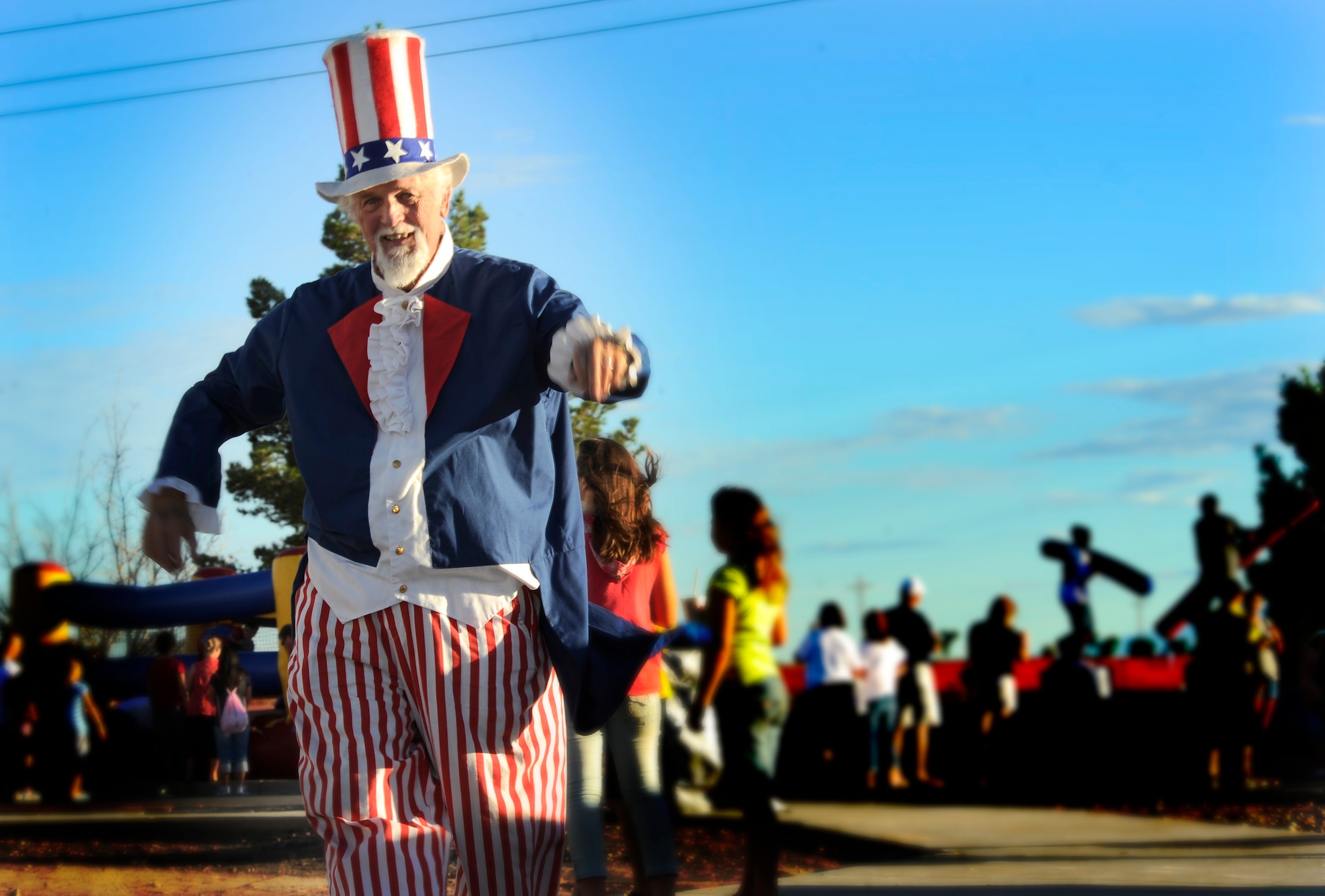 HOLLOMAN AIR FORCE BASE, N.M. -- Uncle Sam, a resident of Alamogordo, walks around the Fourth of July Celebration to thank members of Team Holloman for their service July 2, 2010. Dressed up for the event, Uncle Sam entertained the crowd at Holloman to show his support for those who have served in the military. (U.S. Air Force photo illustration by Senior Airman Veronica Stamps / Released)