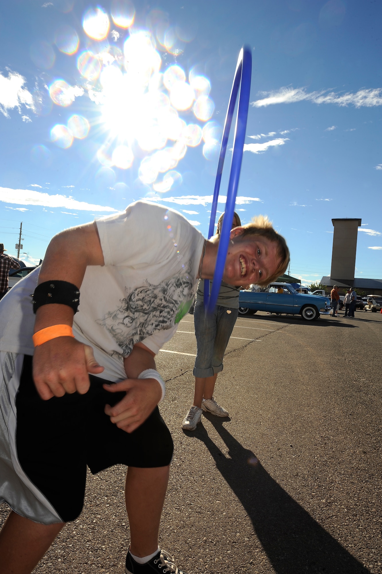 HOLLOMAN AIR FORCE BASE, N.M. -- Members of Team Holloman participate in a hula-hoop contest to see who could be the last one standing during the Fourth of July Celebration held at the Domenici Fitness and Sports Center July 2, 2010. Other events hosted by the Community Activities Center included sack racing, water balloon tossing and frozen t-shirt contests. (U.S. Air Force photo by Senior Airman Veronica Stamps / Released)