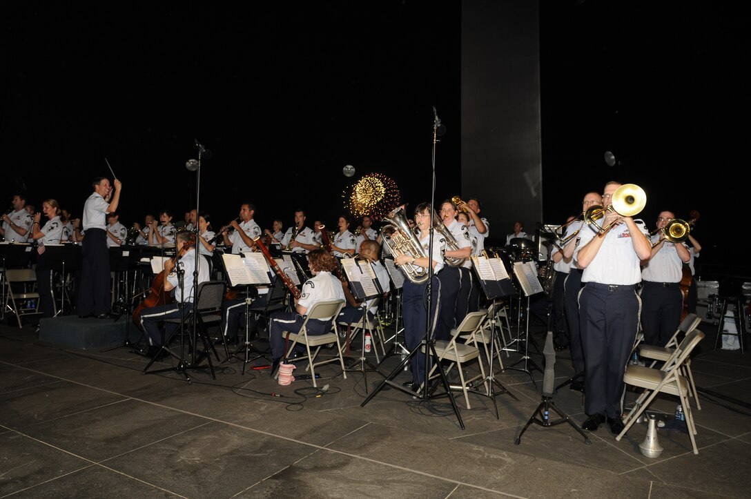 Maj. Gen. Darrell D. Jones, Air Force District of Washington commander, conducts the United States Air Force Concert Band during the Independence Day concert July 4. The Concert Band and Singing Sergeants performed at the memorial in celebration of Independence Day. The event culminated in a view of the National fireworks from across the Potomac River. For more information, please visit www.usafband.af.mil. (U. S. Air Force photo by Senior Airman Jaclyn McDonald)