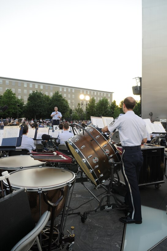 Lt. Col. A. Phillip Waite, the United States Air Force Band commander and conductor, conducts the Concert Band during the Independence Day concert July 4. The Concert Band and Singing Sergeants performed at the memorial in celebration of Independence Day. The event culminated in a view of the national fireworks from across the Potomac River For more information, please visit www.usafband.af.mil. (U. S. Air Force photo by Senior Airman Jaclyn McDonald)