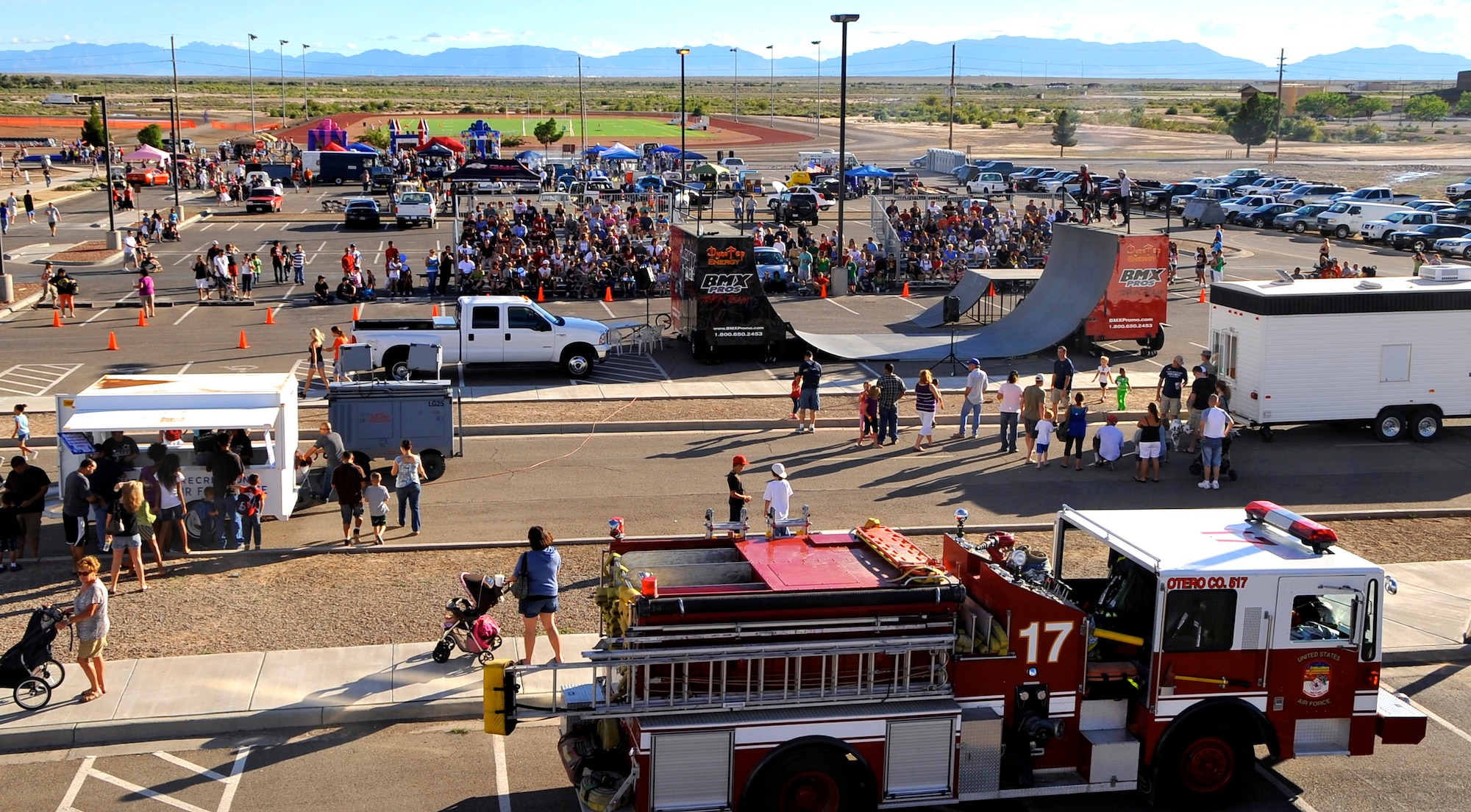 HOLLOMAN AIR FORCE BASE, N.M. -- Members of Team Holloman and guests enjoy the Fourth of July celebration at the Domenici Fitness and Sports Center parking lot July 2, 2010. This years festivities included a professional BMX team who thrilled onlookers with jaw-dropping stunts.  (U.S. Air Force photo by Tech. Sgt. Chris Flahive/Released)