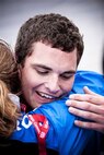 McGuire hugs Air Force team coach Cami Stock after competing the 1,500 meter run during the wounded Warrior Games,Air Force Academy, Colorado Springs, Colo. (TSgt Samuel Bendet) 