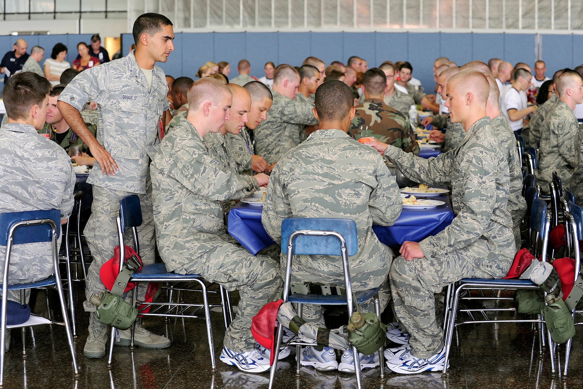 Cadet 2nd Class Jared Goodin ensures proper meal procedures are followed during the first day of basic cadet training at the U.S. Air Force Academy, Colo., June 25, 2010. The day also included an introduction to the physical training regimen. (U.S. Air Force photo/Mike Kaplan
