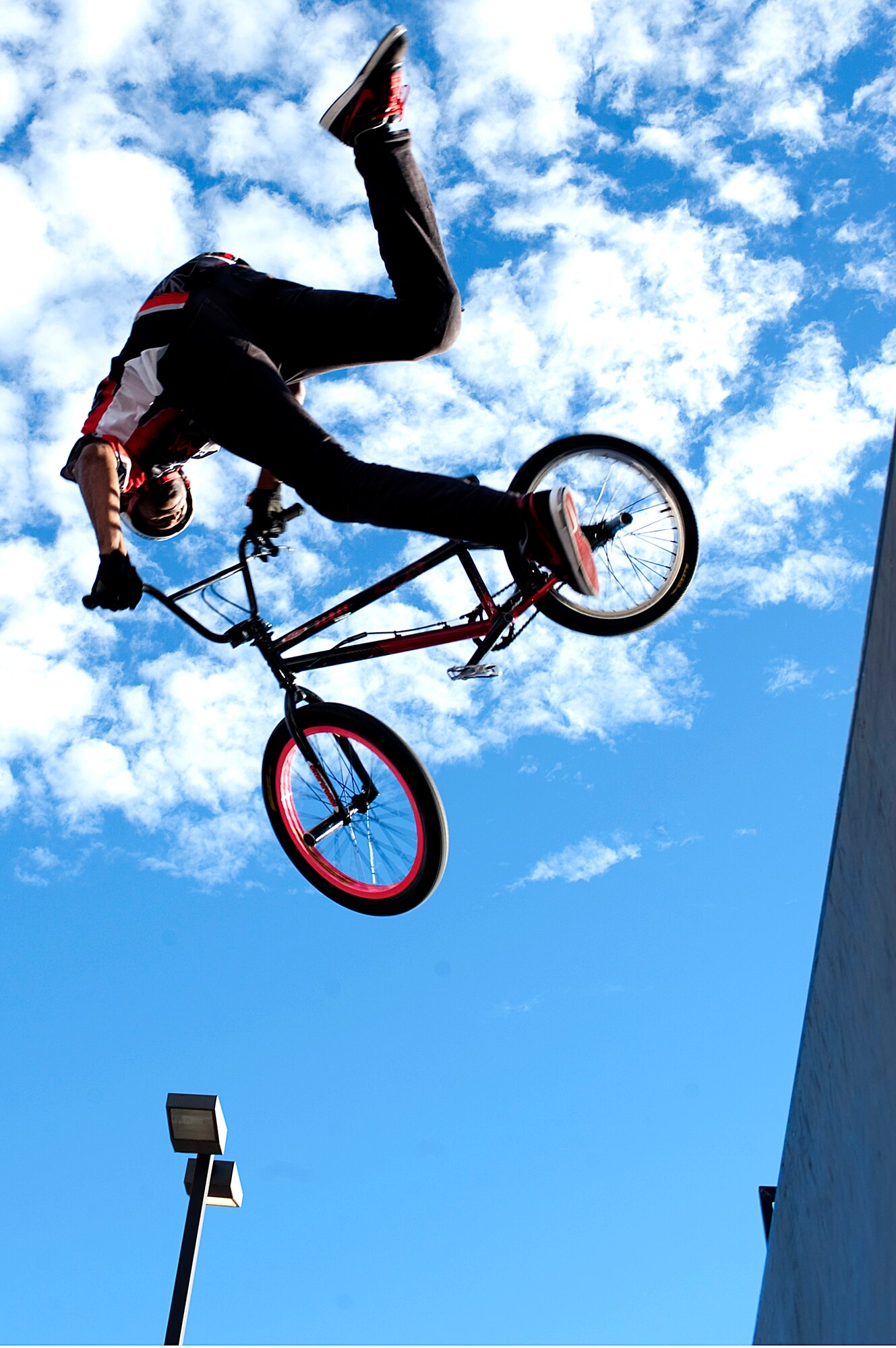 HOLLOMAN AIR FORCE BASE, N.M. -- A BMX bike rider from Los Angeles, Calif., performs a variation of tricks for the crowd at the Fourth of July celebration July 2, 2010. The BMX demo team was one of the main attractions for the event held to celebrate Independence Day. They performed at three different times showing a variety of tricks and moves. (U.S. Air Force photo by Senior Airman DeAndre Curtiss / Released)