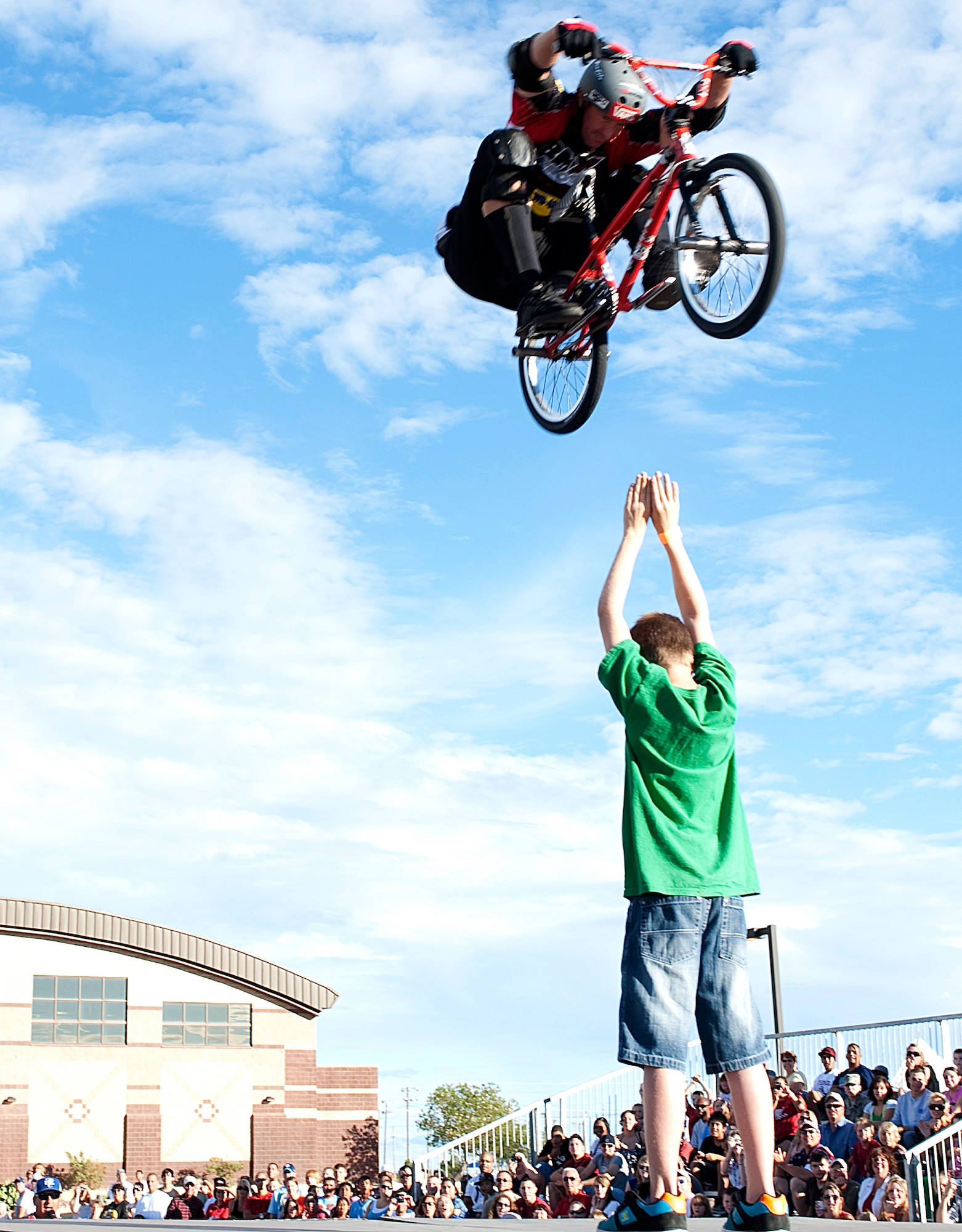 HOLLOMAN AIR FORCE BASE, N.M. -- A BMX bike rider from Los Angeles, Calif., performs a jump over a volunteer from the crowd at the Fourth of July celebration July 2, 2010. The BMX demo team was one of the main attractions for the event held to celebrate Independence Day. They performed at three different times showing a variety of tricks and moves. (U.S. Air Force photo by Senior Airman DeAndre Curtiss / Released)