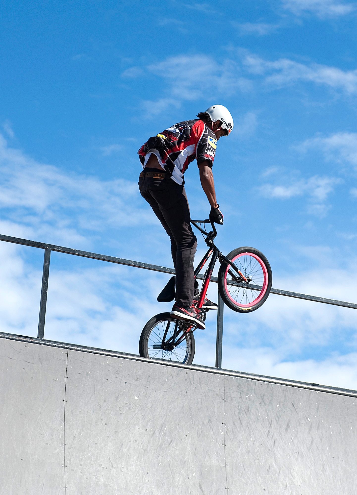 HOLLOMAN AIR FORCE BASE, N.M. -- A BMX bike rider from Los Angeles, Calif., performs a variety of tricks for the crowd at the Fourth of July celebration July 2, 2010. The BMX demo team was one of the main attractions for the event held to celebrate Independence Day. They performed at three different times showing a variety of tricks and moves. (U.S. Air Force photo by Senior Airman DeAndre Curtiss / Released)