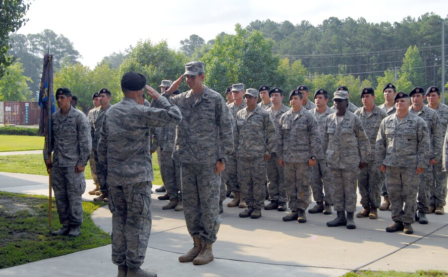 Lt. Col. Anthony Abernathy, 14th Air Support Operations Squadron Commander, salutes Col. Peter Donnelly, 18th Air Support Operations Group Commander, during the ribbon-cutting ceremony at Bldg. 560 here July 1. The 14th ASOS moved into the recently renovated facility after 33 years in their former building in the Joint Special Operations Command Compound. (U.S. Air Force photo/Senior Airman Kris Levasseur)