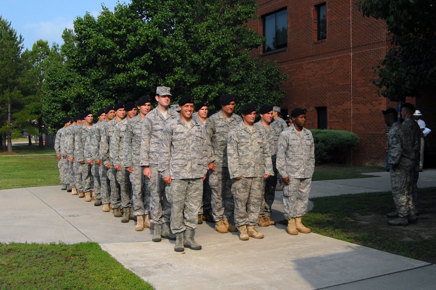 Members of the 14th Air Support Operations Squadron stand in formation before a ribbon-cutting ceremony at Bldg. 560 here July 1. The ceremony commemorated the 14th ASOS’s arrival at their new home in the recently renovated Bldg. 560, across the street from the 18th Air Support Operations Group. (U.S. Air Force photo/Senior Airman Kris Levasseur)