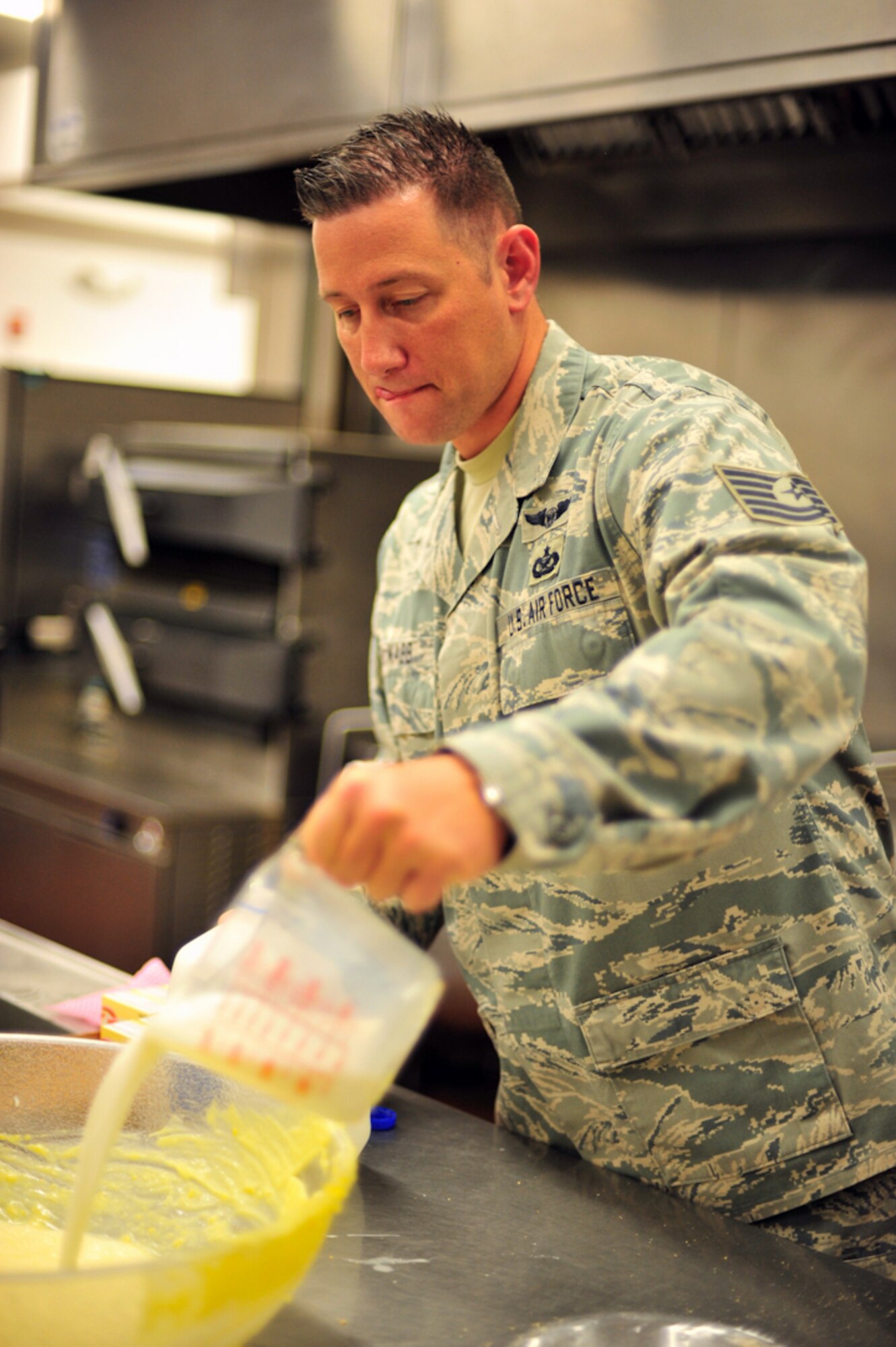 BUCKLEY AIR FORCE BASE, Colo. --  Tech. Sgt. Scott McNabb, 460th Space Wing Public Affairs, prepares vanilla pudding for the pie filling June 30. 50 pies were eaten during the July 1 pie-eating contest for prizes. (U.S. Air Force photo by Staff Sgt. Kathrine McDowell)