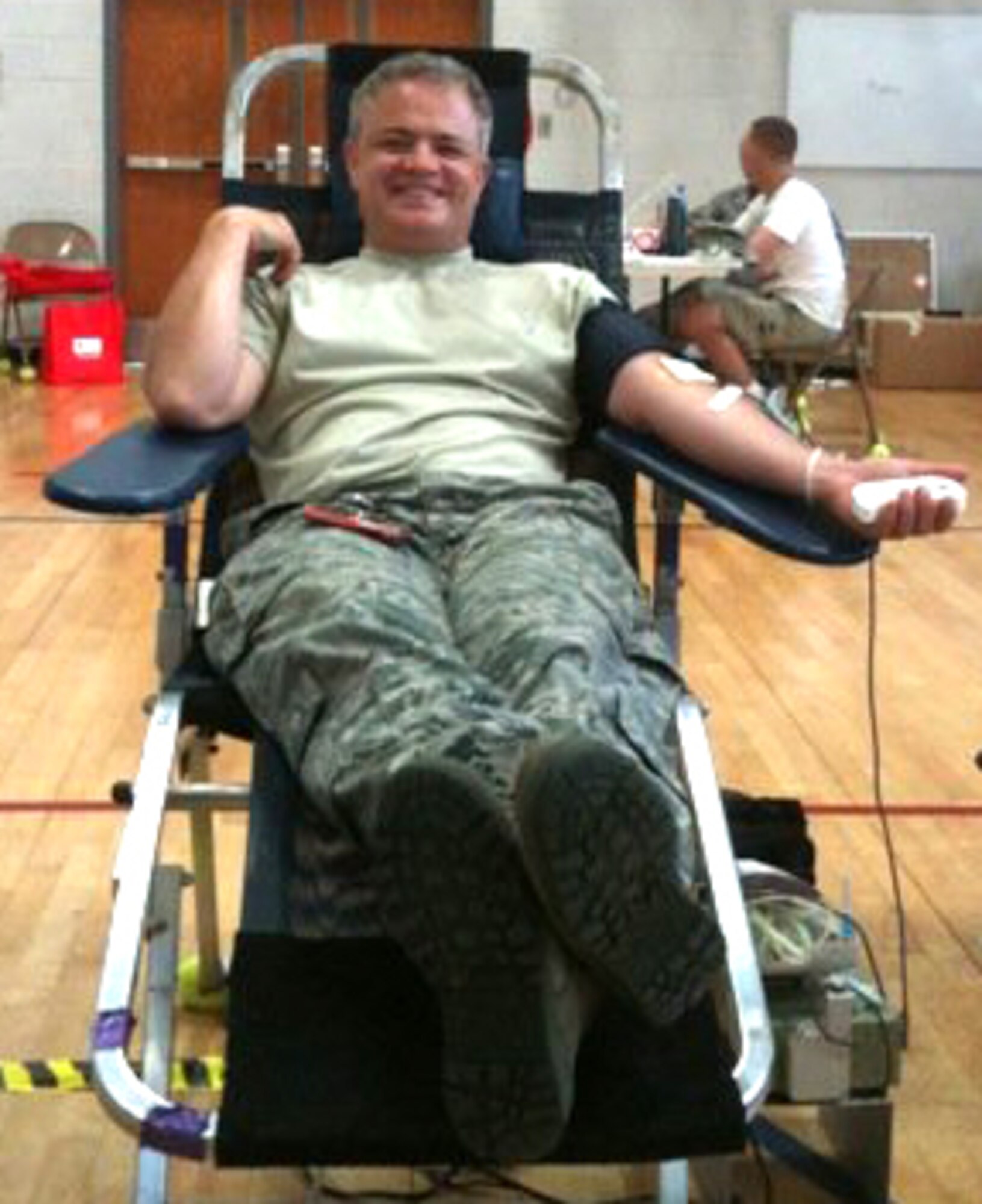 U.S. Air Force Tech. Sgt. Mike Kiker, a crew chief with the 315th Aircraft Maintenance Squadron, donating blood to the American Red Cross at the Sports and Fitness Center June 23, 2010, at Charleston Air Force Base, S.C. (U.S. Air Force photo/Master Sgt. Elizabeth Holzbaur)