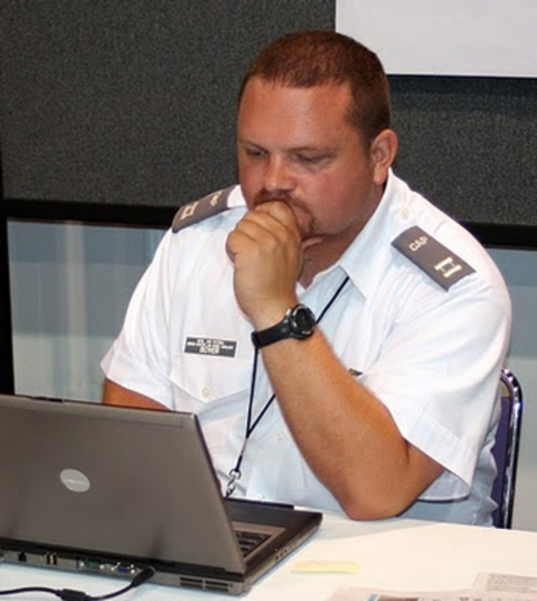 Capt. Ande Boyer, a CAP imaging expert and the Alabama Wing’s director of emergency services, reviews digital data collected by aircrews flying along the Gulf Coast shoreline. Photos by Capt. Phil Norris