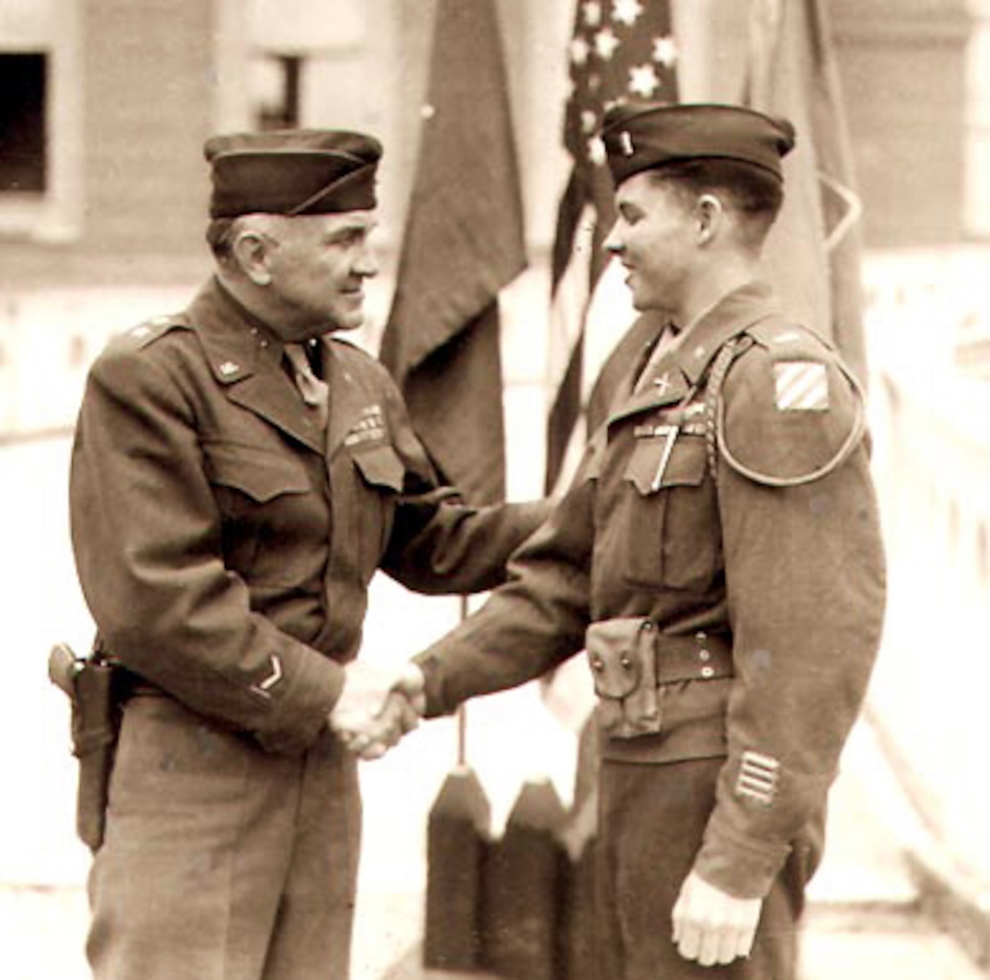 Retired Maj. Gen. John W. O'Daniel presents 1st Lt. Audie Murphy with a Distinguished Service Cross. (Courtesy photo)