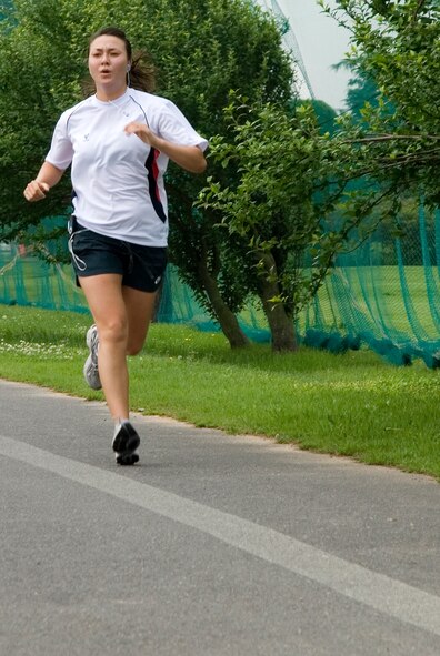 KUNSAN AIR BASE, Republic of Korea --  1st Lt. Fiona Dailey, 8th Fighter Wing executive officer, sprints to the finish line of the Firecracker 5K Fun Run here July 4.  Lieutenant Dailey finished in first place in the female category with an overall time of 24 minutes and 11 seconds. In addition to the five kilometer run, there was also a firefighter relay race, cardboard boat race, a free barbecue and more, culminating in a fireworks show at the end of the night.(U.S. Air Force photo/Staff Sgt. Jonathan Pomeroy)