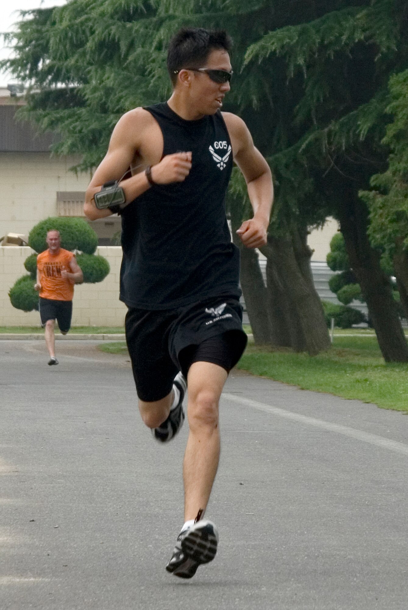 KUNSAN AIR BASE, Republic of Korea -- Airman Anthony Prochaska, 8th Logistics Readiness Squadron mobility specialist, sprints to the finish line of the Firecracker 5K Fun Run here July 4. Airman Prochaska finished in first place in the male category with an overall time of 21 minutes and 8 seconds. In addition to the five kilometer run, there was also a firefighter relay race, cardboard boat race, a free barbecue and more, culminating in a fireworks show at the end of the night.(U.S. Air Force photo/Staff Sgt. Jonathan Pomeroy)