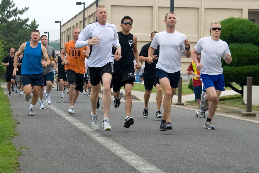 KUNSAN AIR BASE, Republic of Korea -- Participants sprint down the road during the opening event of the 4th of July festivities here, the Firecracker 5K Fun Run. In In addition to the five kilometer run, there was also a firefighter relay race, cardboard boat race, a free barbecue and more, culminating in a fireworks show at the end of the night. (U.S. Air Force photo/Staff Sgt. Jonathan Pomeroy)