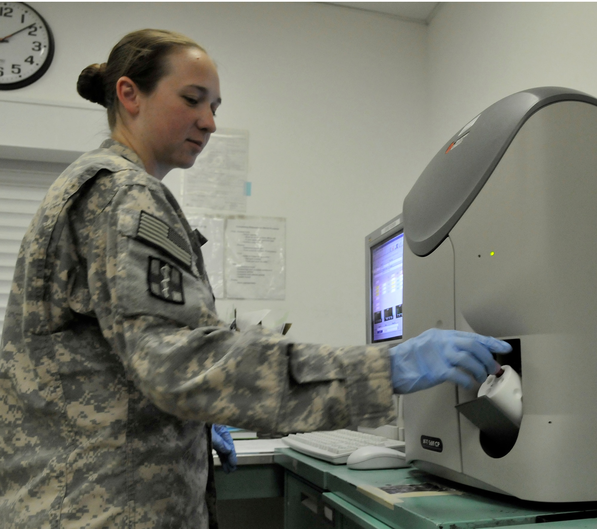 Army Sgt. Kristen Tottens, 932nd Blood Support Detachment aphaeresis NCO in charge, loads a blood sample into a blood separator-analyzer to check for platelet levels July 5, 2010, Joint Base Balad, Iraq. Platelets are the component in a human’s blood that closes wounds and creates scabs. Sergeant Totten is deployed from Fort Hood, Texas. (U.S. Air Force photo/Staff Sgt. Phillip Butterfield)
