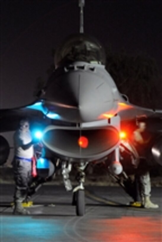 U.S. Air Force airmen from the 169th Maintenance Group out of McEntire Joint National Guard Base, S.C., perform post-flight checks on an F-16 Fighting Falcon aircraft at Joint Base Balad, Iraq, following a mission on June 29, 2010.  
