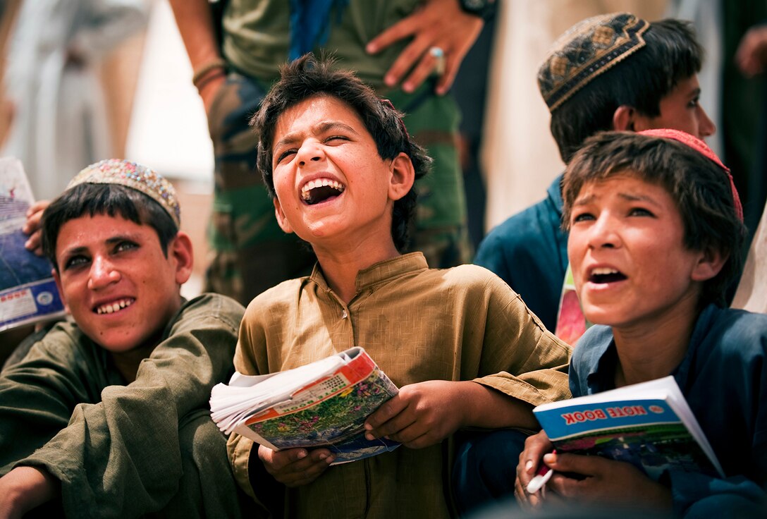 Wali Muhammad and other Afghan boys call out the letter their teacher points to during class at the Forward Operating Base Geronimo schoolhouse in Afghanistan, July 8, 2010. Most of the kids who attend school are younger than the current war. The children are taught by Marine, Navy and Afghan volunteers. (Official Marine Corps photo by Sgt. Mark Fayloga)