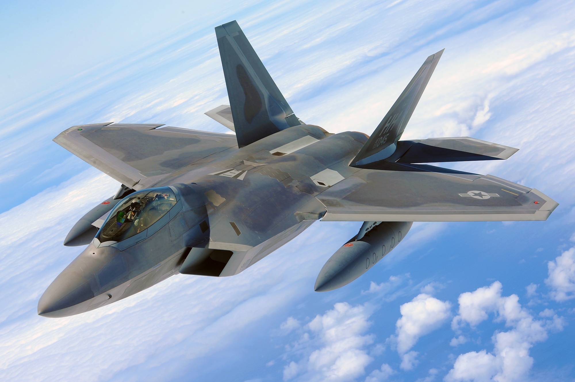 An F-22 Raptor Soars through the skies on its way home to Joint Base Pearl Harbor Hickam, Hawaii July 1. The first two of twenty F-22 Raptors, the U.S. Air Force's most advanced fighter jet, will be dedicated on Friday, July 9, 2010 at a Joint Base Pearl Harbor-Hickam ceremony at 9 a.m. at the Base Operations building. The ceremony will mark the beginning of the partnership between the Hawaii Air National Guard and the active duty Air Force flying the “fifth generation? fighter at Hickam. The F-22 Raptors will be flown by pilots from the 199th Fighter Squadron, 154th Wing, Hawaii Air National Guard and active duty Air Force pilots from the 19th Fighter Squadron, 15th Wing. The aircraft will also be maintained by a combination of Hawaii Air National Guardsmen and active duty Airmen. (U.S. Air Force photo by Senior Airman Gustavo Gonzalez)