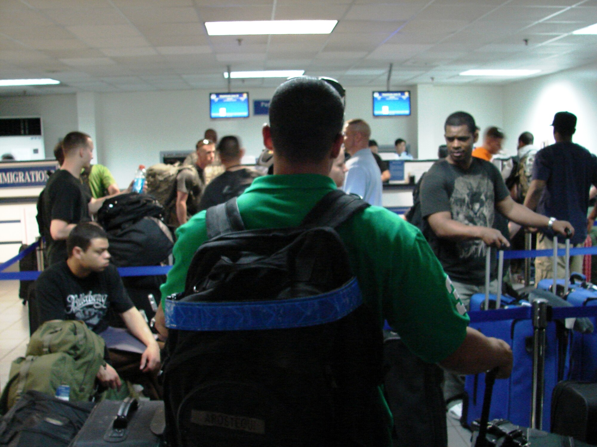 Osan passengers process through the passenger terminal prior to boarding a Patriot Express flight June 8. (U.S. Air Force photo/Staff Sgt. Eric Burks)